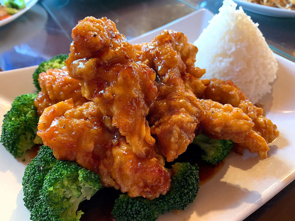 The crispy chicken dish is slathered in chili paste and served with rice and broccoli. (Evan Thompson / The Herald)
