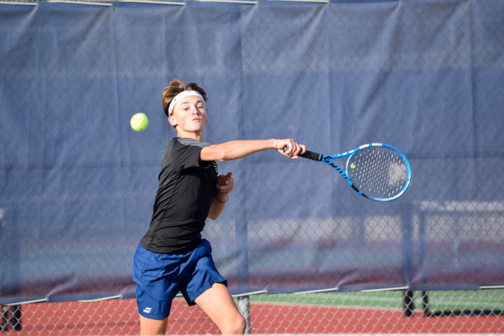 Lynnwood’s Nicolas Desgrippes plays in the 3A district tennis singles final on Wednesday, Oct. 30 at Arlington High School. (Katie Webber / The Herald)
