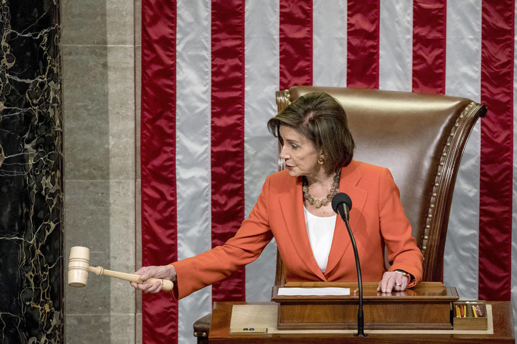 House Speaker Nancy Pelosi gavels as the House votes 232-196 to pass resolution on impeachment procedure to move forward into the next phase of the impeachment inquiry into President Trump in the House Chamber on Capitol Hill in Washington on Thursday. (AP Photo/Andrew Harnik)
