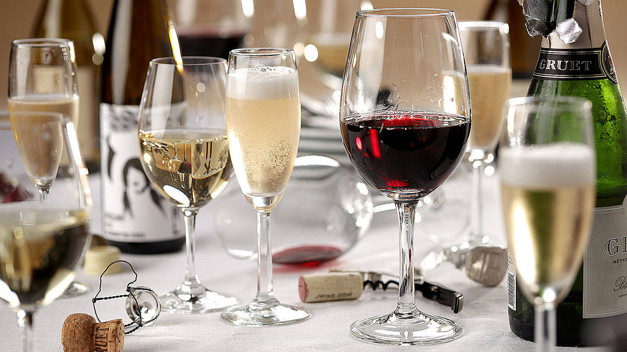 Just one white and one red? Not at our Thanskgiving. Get a variety of inexpensive bottles, and let your guests dirty as many glasses as they want. (Michael Tercha/Chicago Tribune)