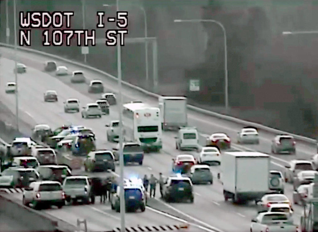 Law enforcement vehicles converged at the scene of a crash on I-5 near Northgate in Seattle after a chase that began in Lynnwood on Jan. 16. (Washington State Department of Transportation, file)

