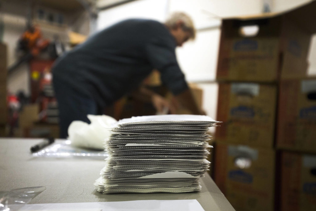A stack of orders is proof an appearance on the TV show “Shark Tank.” Owners Gabe and Jessica Miller are busy keeping up. (Andy Bronson / The Herald) 
