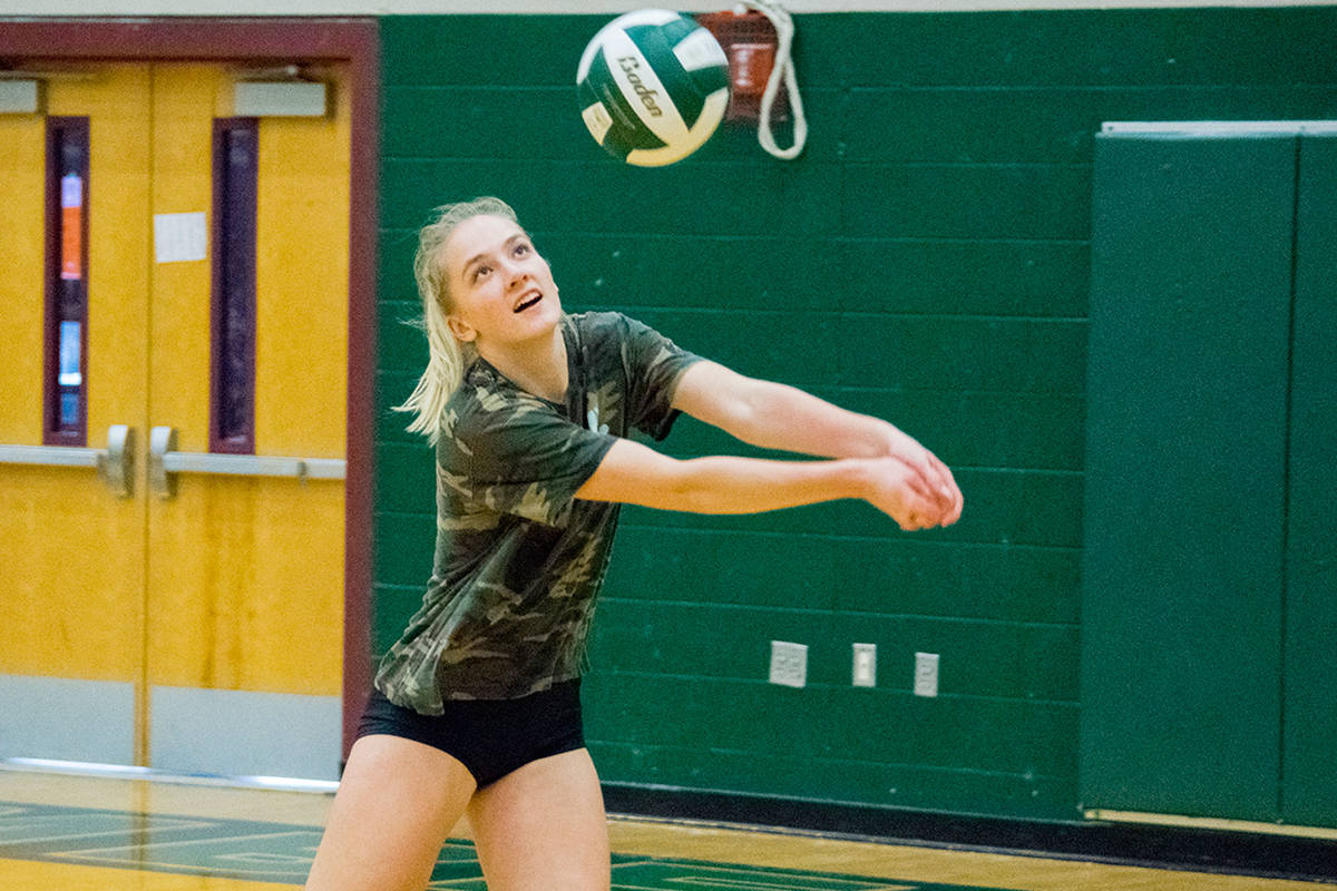 Jackson’s Paige Wilson digs a ball at the Timberwolves’ team practice on Oct. 24 at Jackson High School in Mill Creek. (Katie Webber / The Herald)