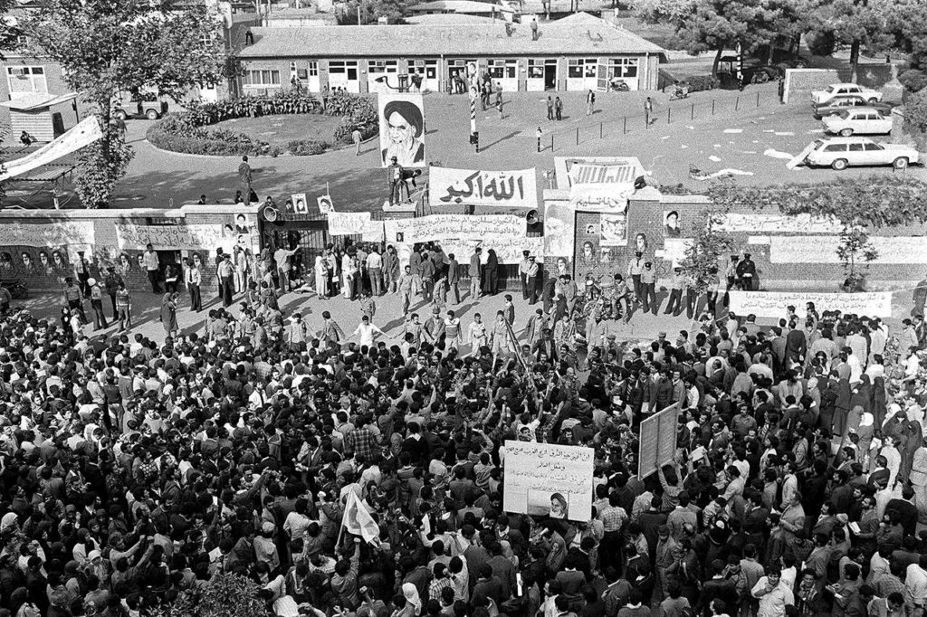 In this Nov. 13, 1979 photo, Iranians pray and gather in front of the American Embassy in Tehran, Iran, where Islamic revolutionary students had been holding American employees hostage since Nov. 4, 1979. (AP Photo)
