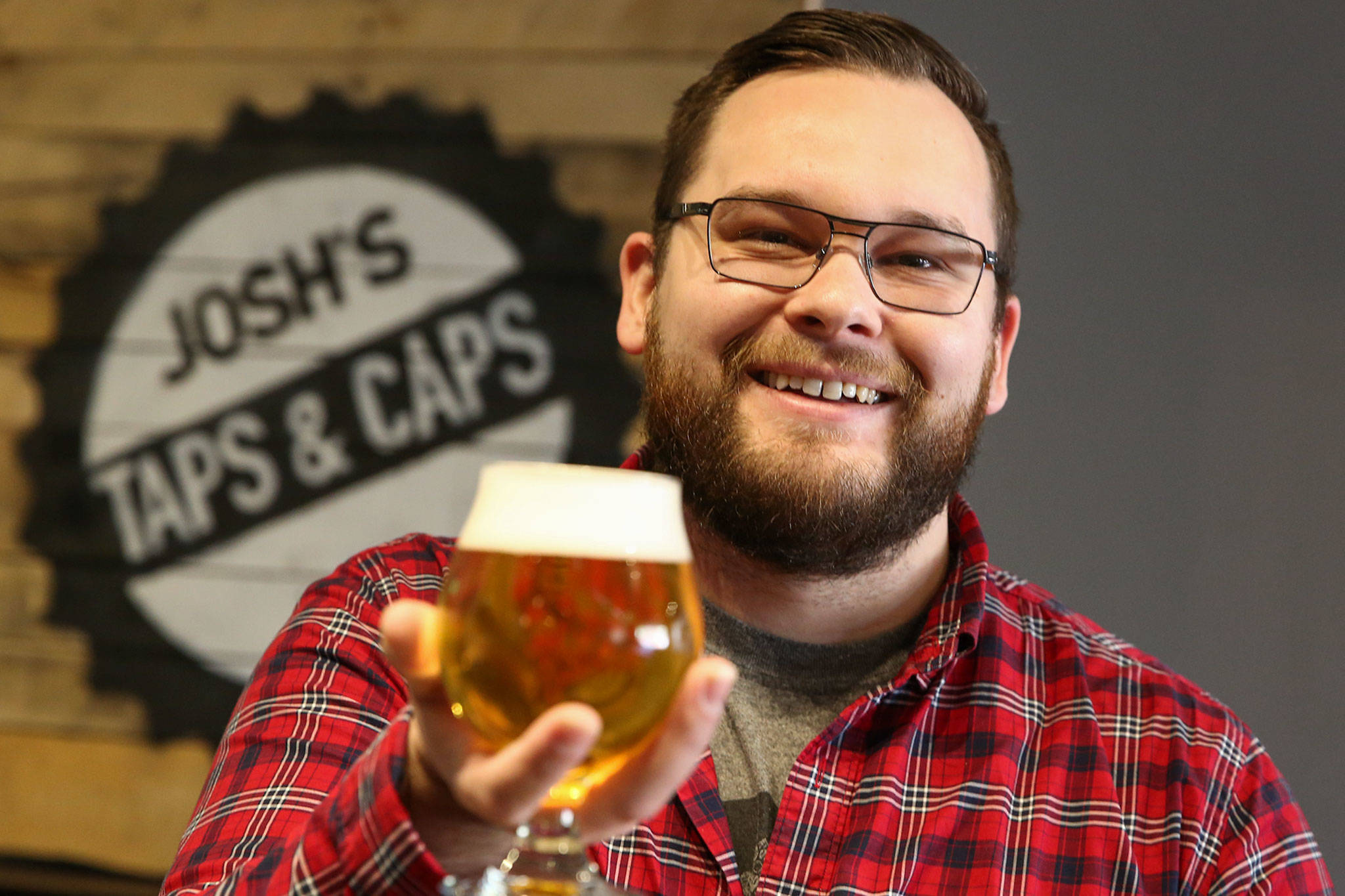 Blake Fitzgerald is a certified cicerone at Josh’s Taps & Caps in Snohomish. (Kevin Clark / The Herald)
