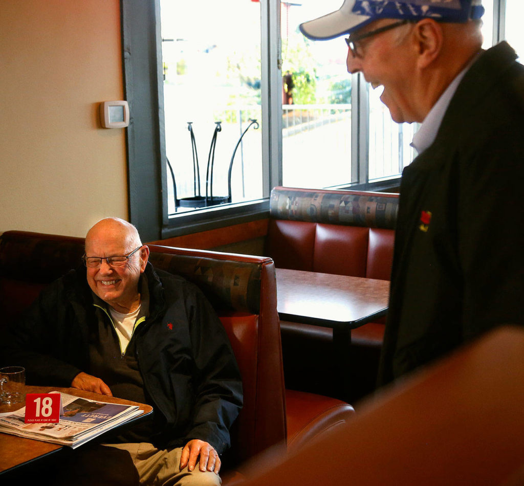 After bowling at nearby Glacier Lanes, Mike Kapustin, 82, (left), always eats breakfast at Burgermaster, which is owned by Jack Simmons’ (right). Simmons is retiring and has sold the place to MOD Pizza. Kapustin and Simmons talk, and laugh a bit, yet each admits he’ll miss the other. (Dan Bates / The Herald)

