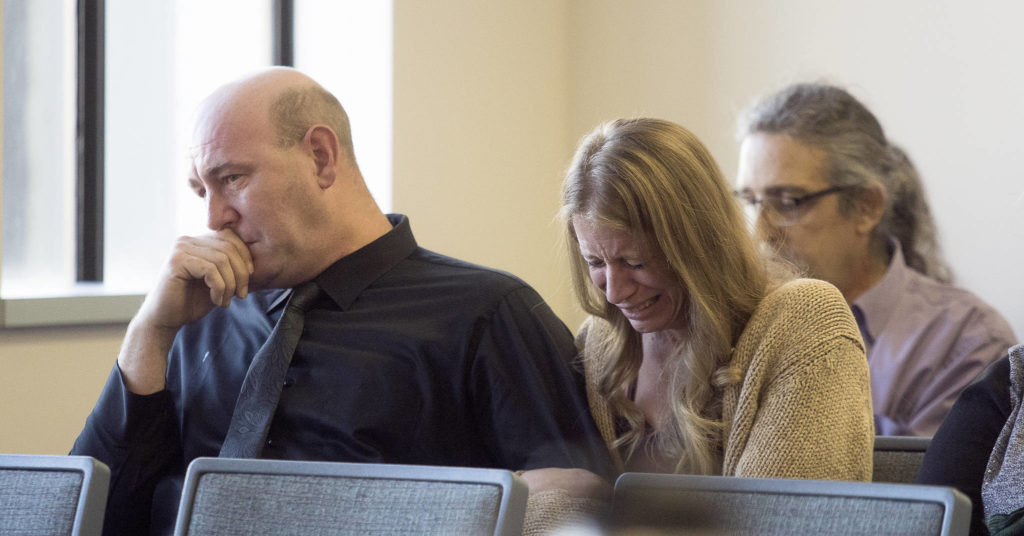 The parents of Gala Zuehlke, Jeremy Clark and Amanda Intveld, react as Timothy Puller is sentenced for Zuehlke’s death in the Snohomish County Courthouse on Thursday in Everett. (Andy Bronson / The Herald)
