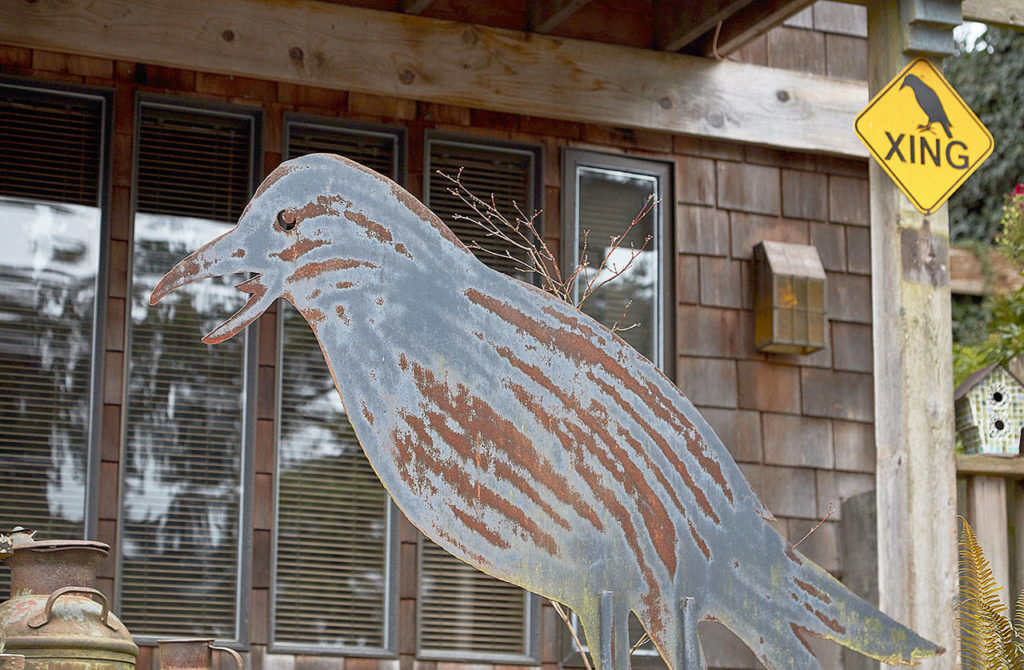 Metal crows by Langley artist Tim Leonard are in front of Sharen Heath’s home. (Quinn Brown)
