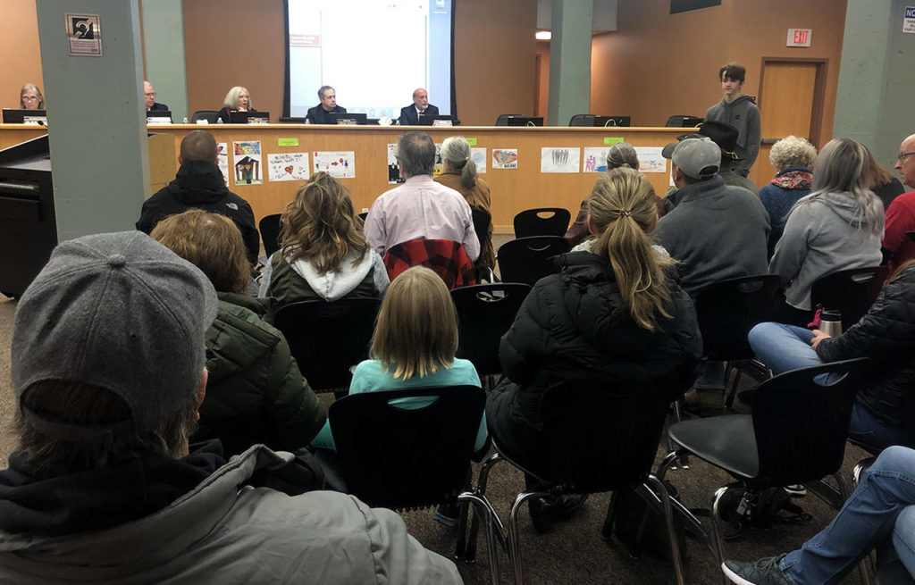 About 50 people attended Wednesday’s Stanwood-Camano School Board meeting. Board member Chad Lewis (second from right) resigned his seat following the contentious meeting. (Julia-Grace Sanders / The Herald)
