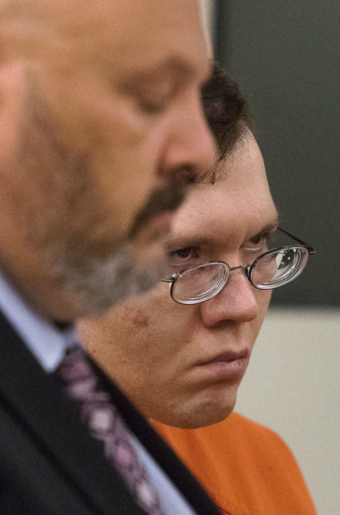 Anthony Garver listens to the prosecutor during his sentencing for the murder of Phillipa Evans-Lopez on Wednesday in the Snohomish County Courthouse in Everett. Garver was sentenced to 32 years and one month in prison. (Andy Bronson / The Herald)
