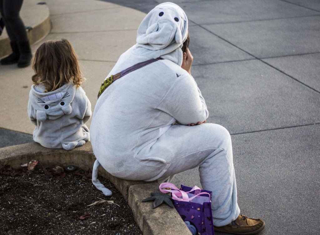 Two Totoro’s sit next to each other in Wetmore Plaze during Downtown Trick-or-Treating on Oct. 31, 2019 in Everett, Wash. (Olivia Vanni / The Herald)