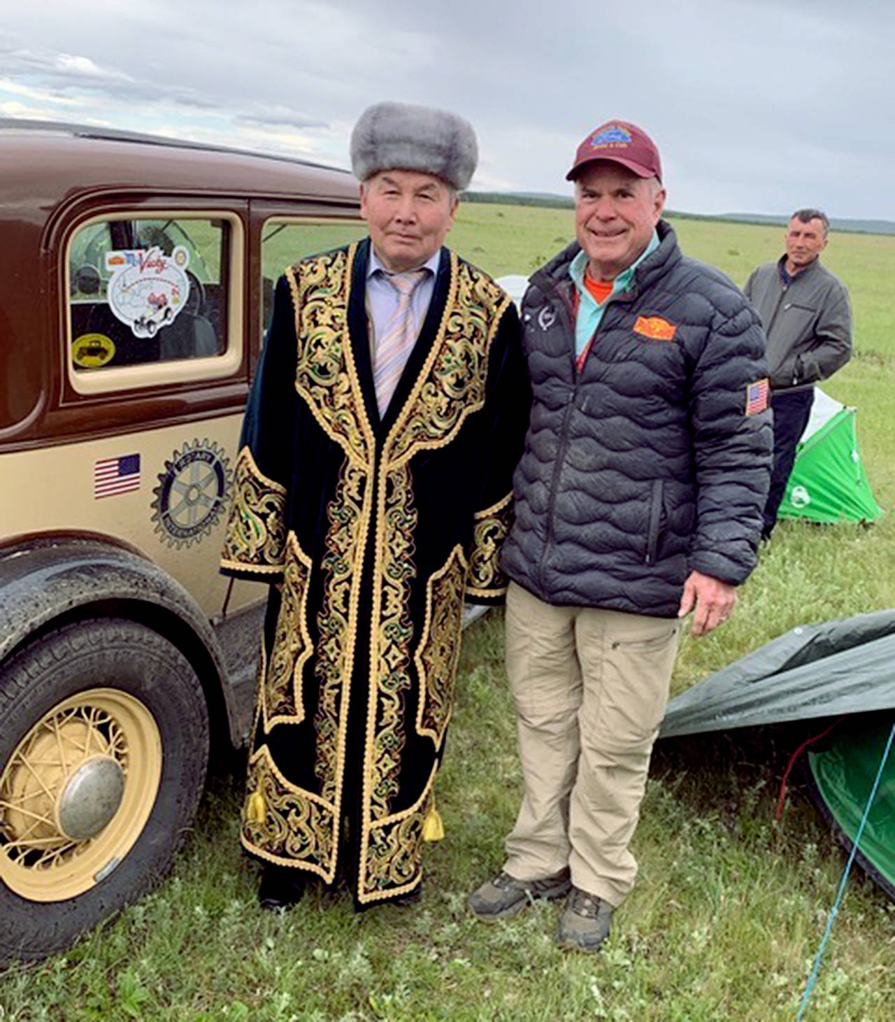 Lee Harmon poses with a Kazakh man in customary costume who was part of a welcoming committee at the Balkashino campsite in Kazakhstan. (Bill Ward)