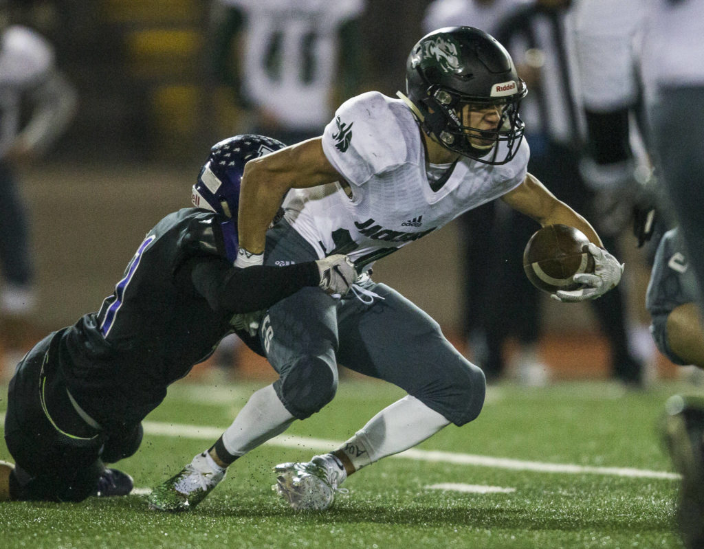 Kamiak’s Mayson Bach tackles Jackson’s Brendan Sandico during the game on Nov. 1, 2019 in Everett, Wash. (Olivia Vanni / The Herald)
