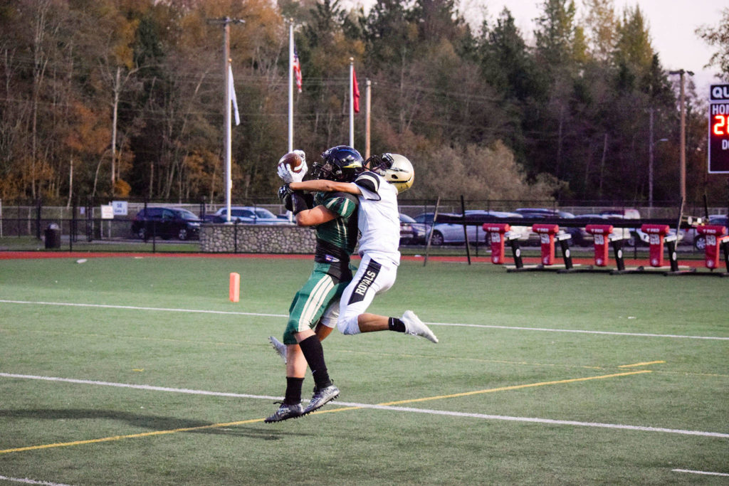 Junior wide receiver Landyn Olson (left) catches a first down for Getchell against Lynnwood on Friday, Nov. 1 at Quil Ceda Stadium in Marysville. (Katie Webber / The Herald)
