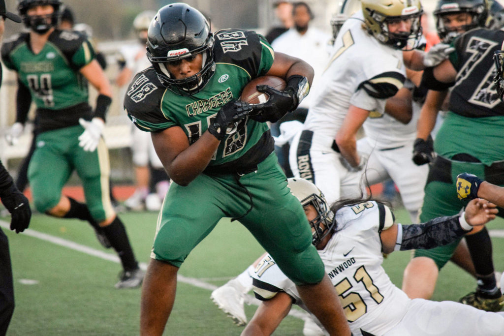 Junior fullback Cheron Smith runs for a first down against Lynnwood on Friday, Nov. 1 at Quil Ceda Stadium in Marysville. (Katie Webber / The Herald)
