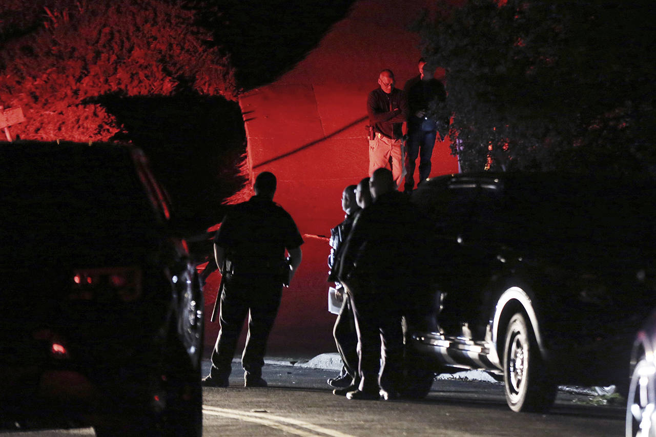 Contra Costa County Sheriff deputies investigate a multiple shooting in Orinda, California on Thursday. Five people were killed and others wounded in a Halloween night party shooting at a large rental home in a wealthy San Francisco Bay Area community. (Ray Chavez/East Bay Times via AP)