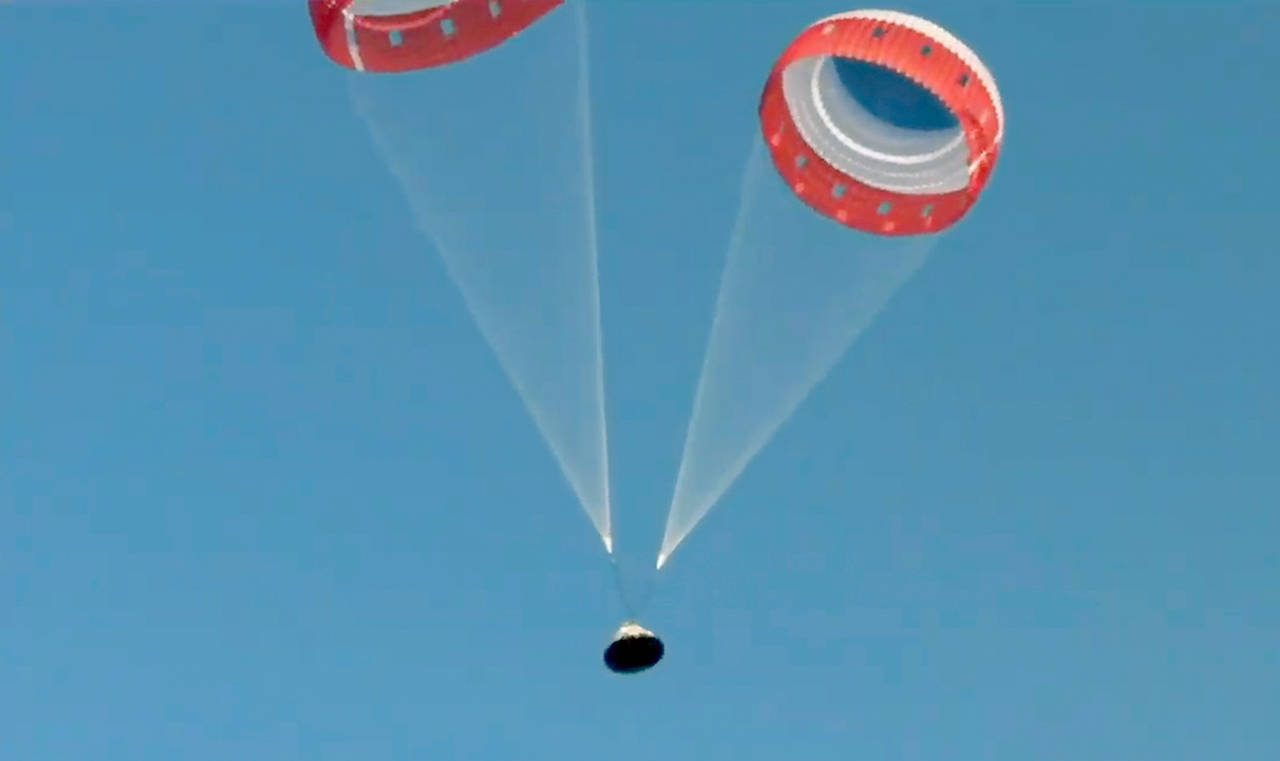 The Starliner drifts to the ground after a test of the Boeing crew capsule’s launch abort system at White Sands Missile Range in New Mexico on Monday. (NASA via AP)