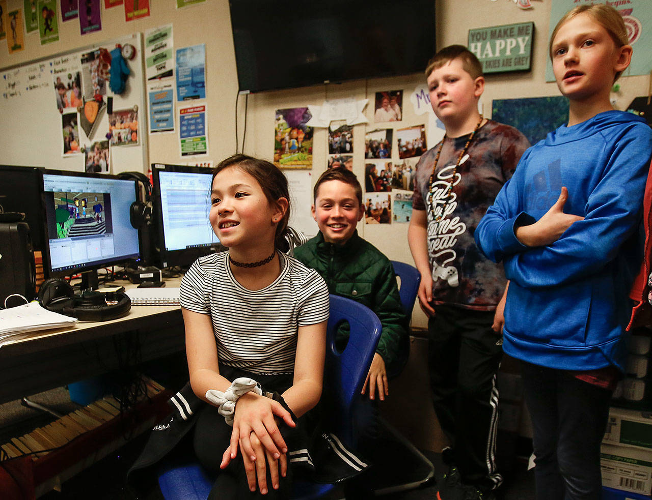 Riverview Elementary students Kalista Nguyen (from left), Cade Yoder, Keagan Ard and Izzy Clare explain Wednesday how they used Story Maker technology to help make the animated movie “The WonderGrove Wizard of Oz.” The project was part of their work in teacher Kimberlee Spaetig-Peterson’s class. (Dan Bates / The Herald)