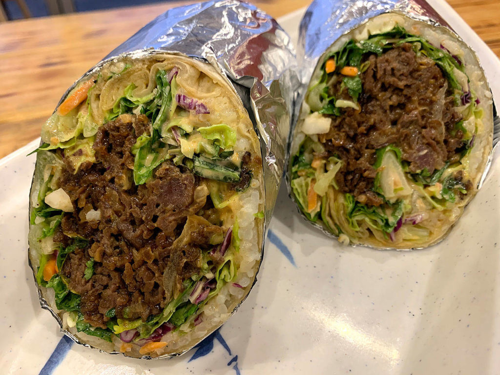 The “Bulgoritto” is a flour tortilla filled with bulgogi (sweet Korean barbecue beef), cilantro, basil, salad greens and rice, with spicy mayo and chile lime dressing.
