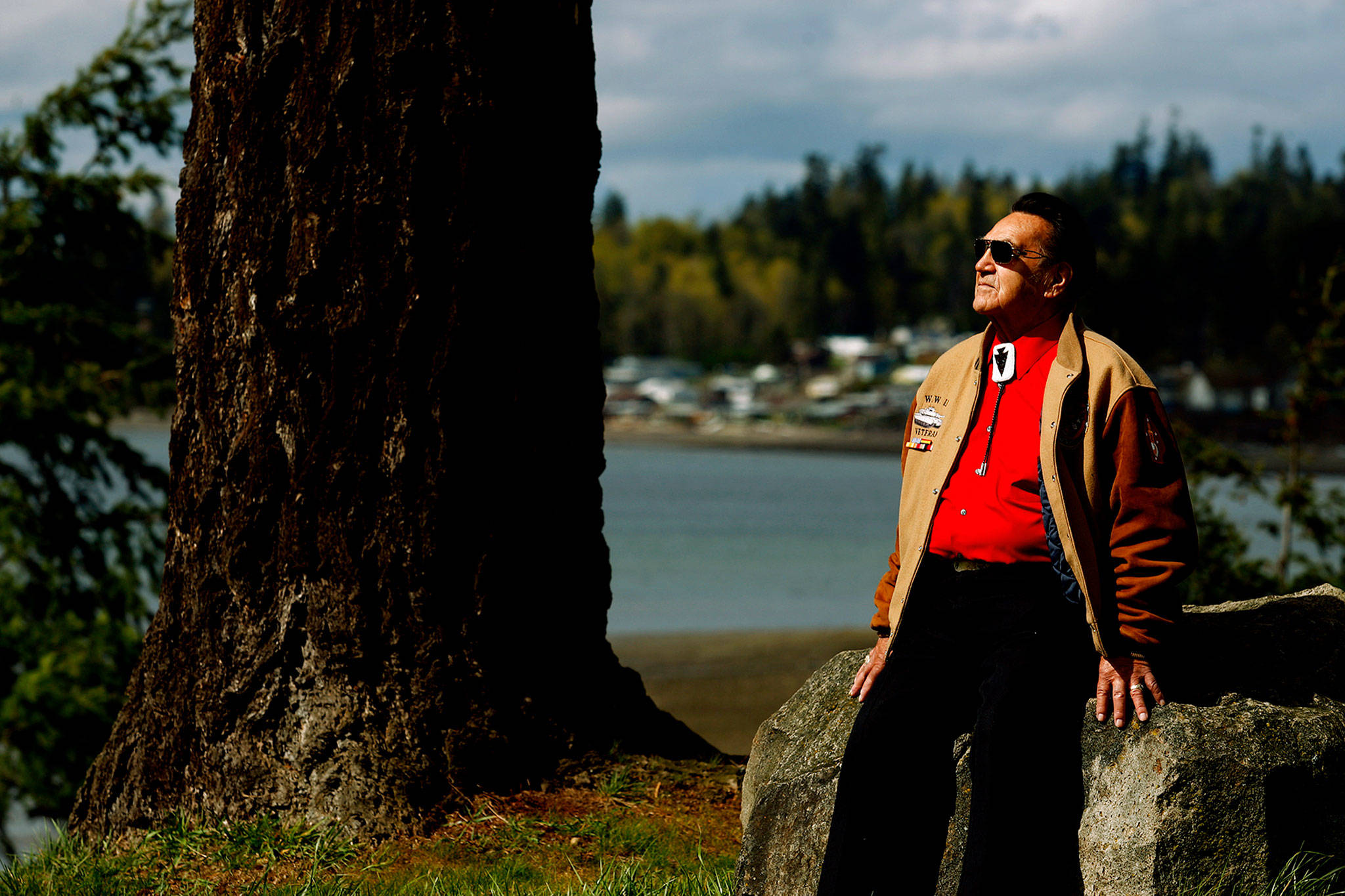 Stan Jones, Sr. scans Tulalip Bay from the grounds outside the old tribal center and longhouse in April 2010. (Dan Bates / Herald file)