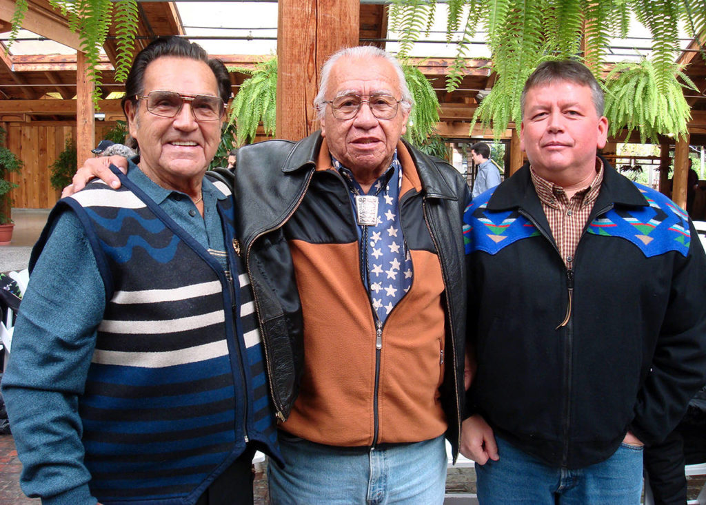 Stan Jones (left) caught up with Billy Frank (center), a Nisqually tribal member who fought for treaty fishing rights in the 1960s and 1970s. A federal court ruling by U.S. District Judge George Boldt in 1974 found the tribes were entitled to half of the harvestable salmon returning to western Washington. Tulalip tribal member Glen Gobin is on the right. (Courtesy of the Jones Family)
