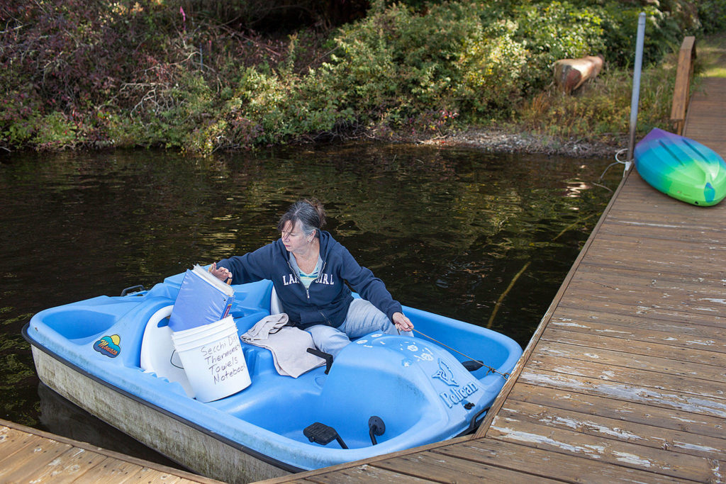 Twice a month Deb Kocher paddles to the middle of Lake Crabapple to collect data. (Lizz Giordano / The Herald)
