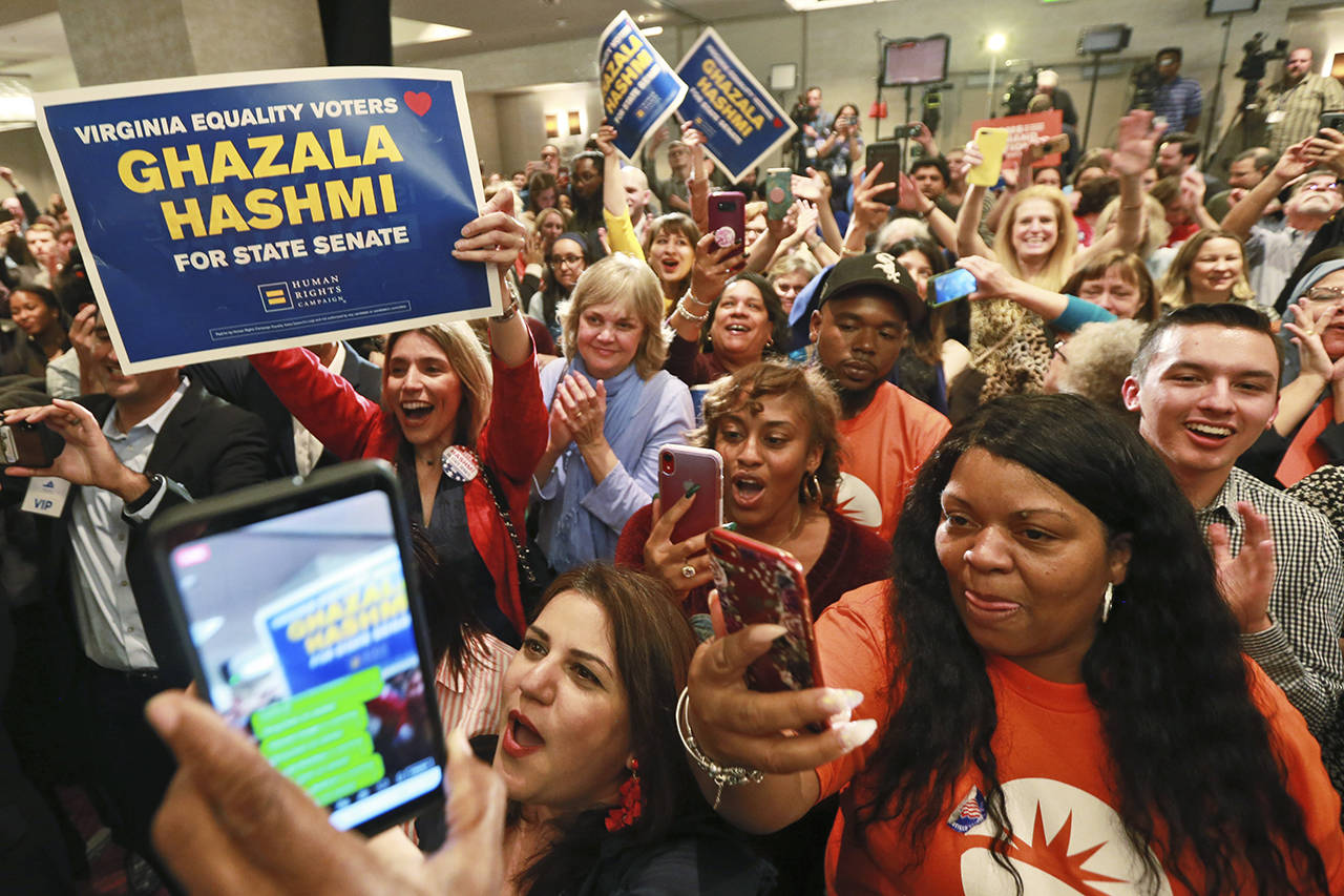 Democratic supporters cheer at their party in Richmond, Virginia, on Tuesday. (AP Photo/Steve Helber)