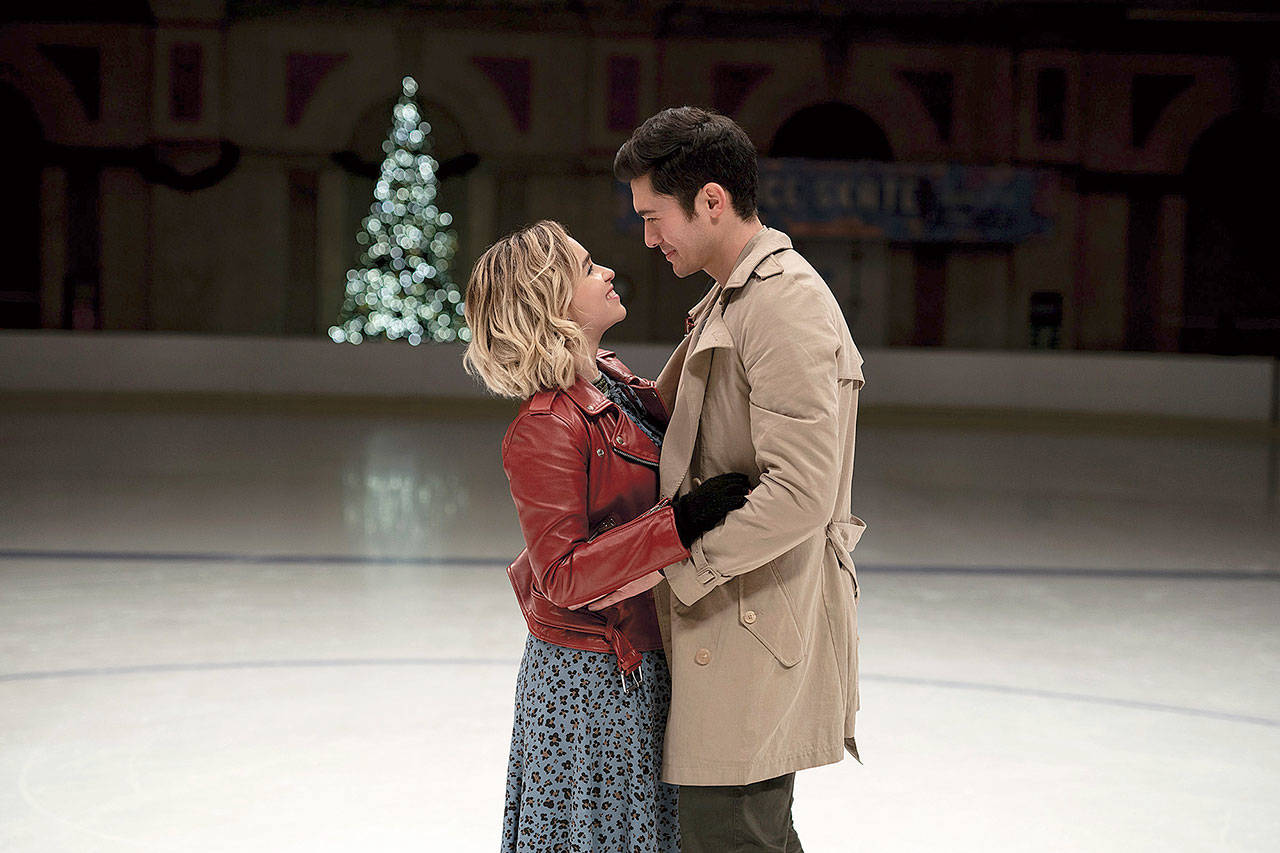 Emilia Clarke and Henry Golding star as a meet-cute couple in “Last Christmas.” (Universal Pictures)
