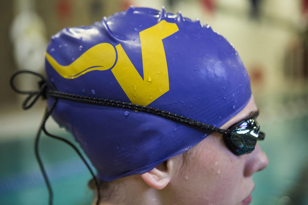 Bailey Kingsbury wears a Lake Stevens swim cap during swim practice at Explorer Middle School on Nov. 6, 2019 in Everett, Wash. (Olivia Vanni / The Herald)

