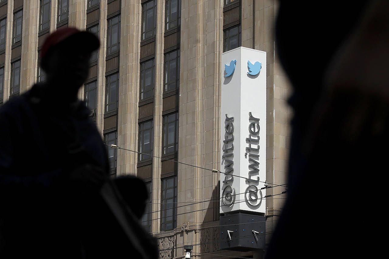 The Saudi government recruited two Twitter employees to get personal account information of their critics, prosecutors said Wednesday. (AP Photo/Jeff Chiu, File)