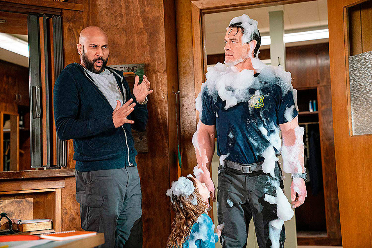 From left, Keegan-Michael Key, Finley Rose Slater and John Cena in a typical moment in “Playing with Fire.” (Paramount Pictures)