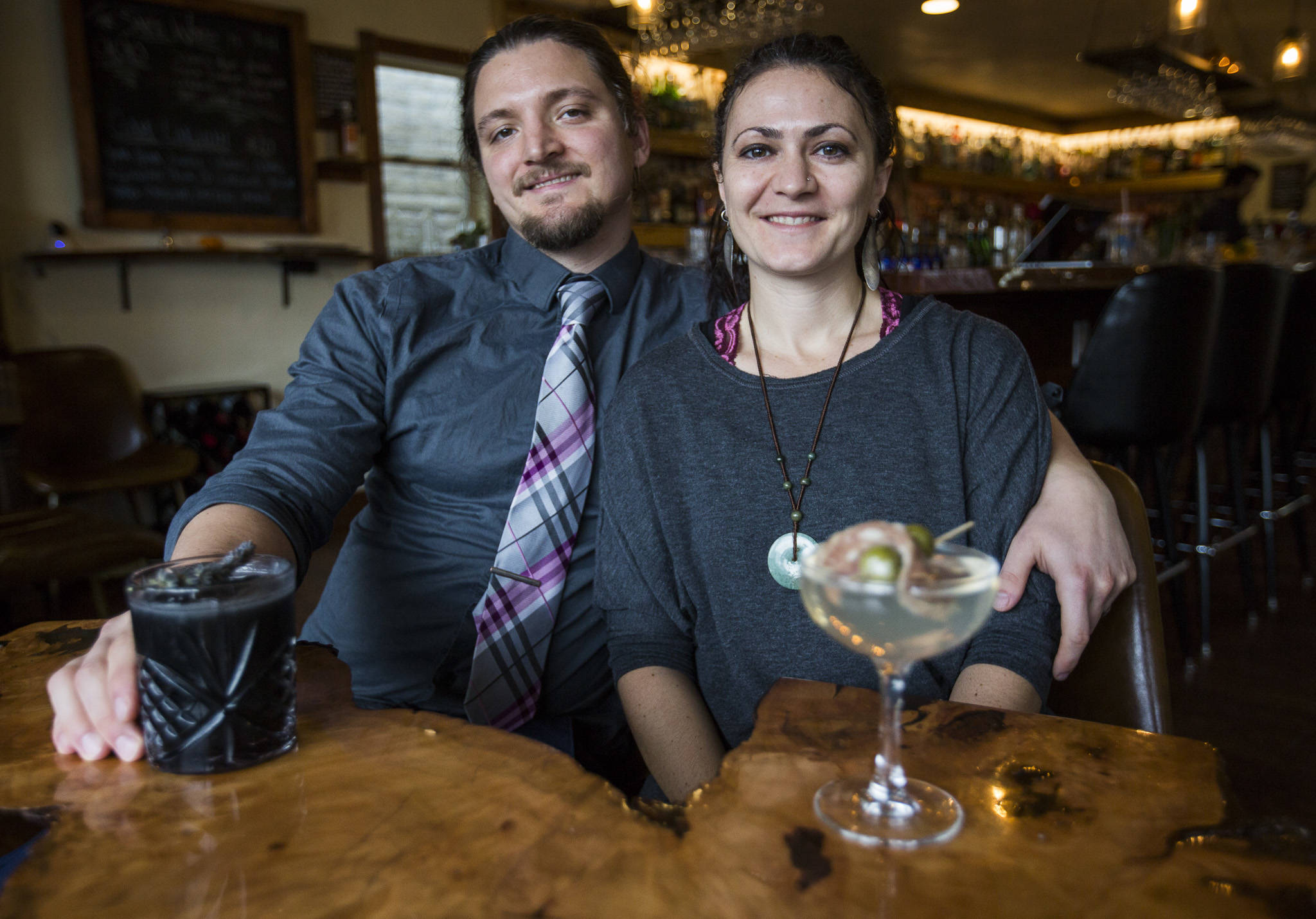 Owners Kris Kelnero, left, and Kali Kelnero with a Dark Arts and martini cocktails at Kelnero, the bar they opened in Edmonds this year. (Olivia Vanni / The Herald)