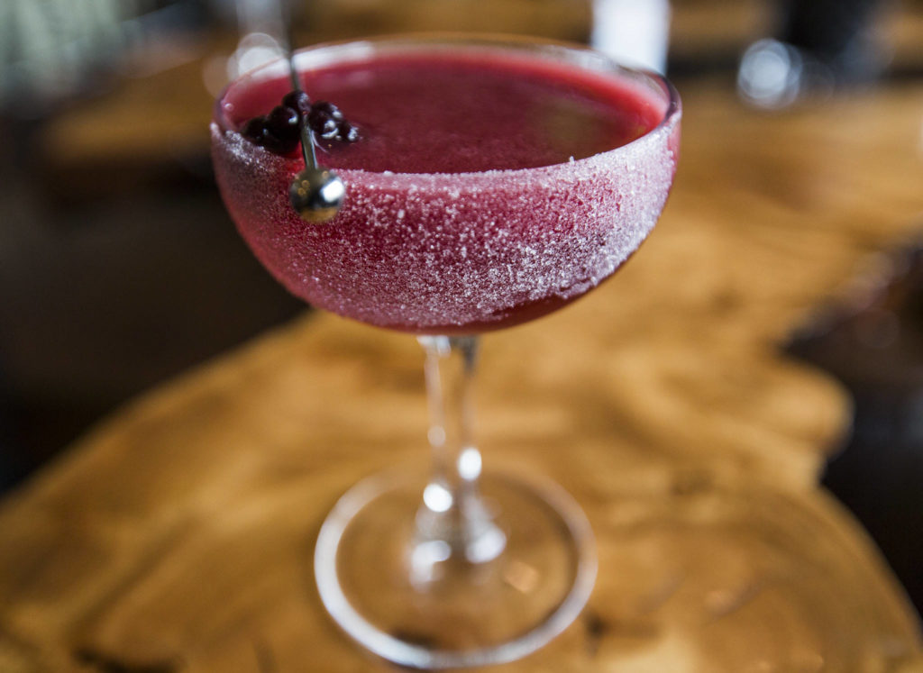 A Black Rose, one of the most popular cocktails at Kelnero, is made with vodka, blackberry juice, lemon, orange curacao, a rose spritz and a crushed sugar rim. (Olivia Vanni / The Herald)
