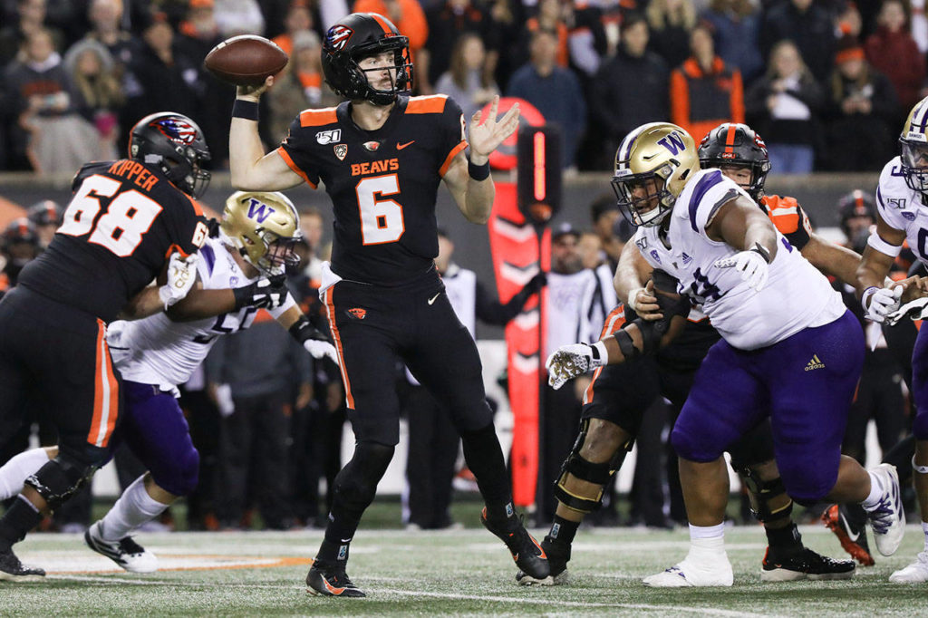 Oregon State quarterback Jake Luton (6), a Marysville Pilchuck High School alum, looks for an open receiver during the first half of a game against Washington Friday in Corvallis, Ore. (AP Photo/Amanda Loman)
