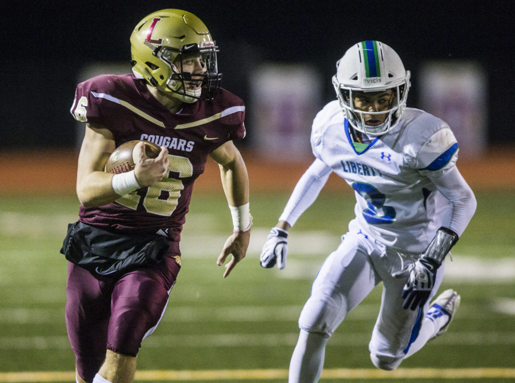 Lakewood’s Jared Taylor runs the ball during a 2A playoff game against Liberty on Nov. 8, 2019 in Arlington, Wash. (Olivia Vanni / The Herald)
