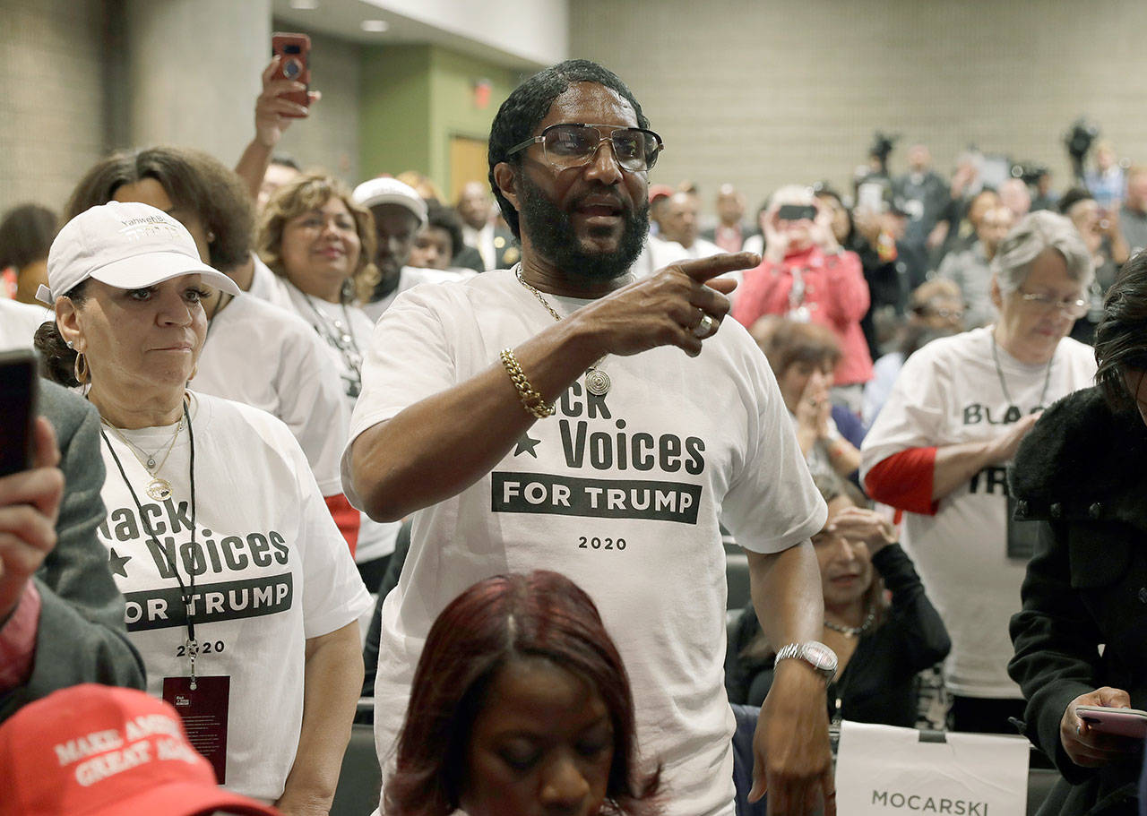 Supporters of President Donald Trump wait to listen to him speak Friday during the launch of “Black Voices for Trump” at the Georgia World Congress Center in Atlanta. (AP Photo/ Evan Vucci)