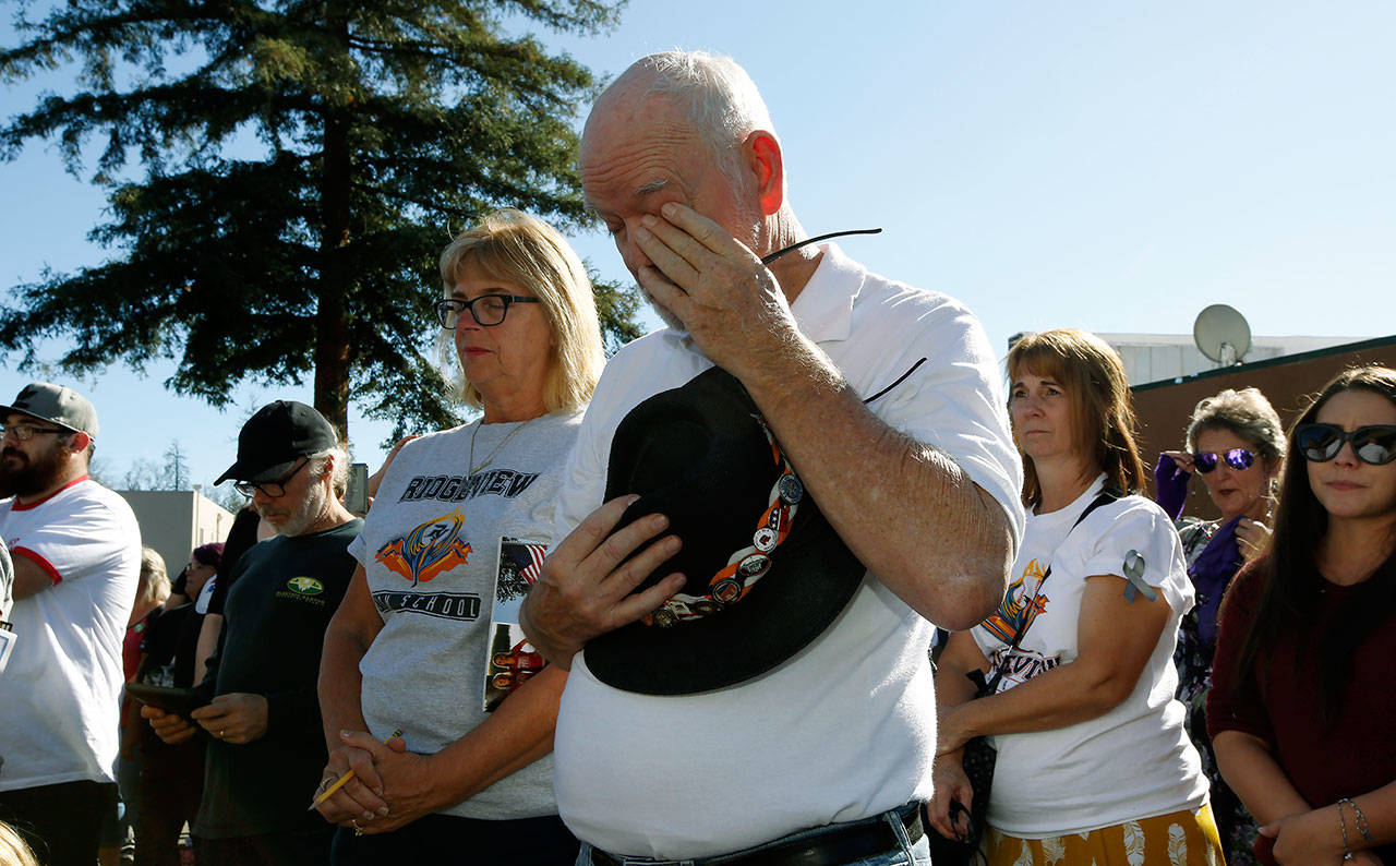 Mike Greer wipes his eyes during the 85 seconds of silence honoring the 85 people who died in last year’s Camp Fire during ceremonies Friday in Paradise, California. Friday marks the one year anniversary of the wildfire that nearly destroyed the entire town of Paradise. (AP Photo/Rich Pedroncelli)