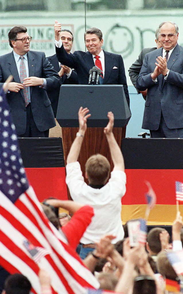 This June 12, 1987 photo shows President Reagan giving a thumbs up sign after his speech in front of the Brandenburg Gate in West Berlin, where he had said “Mr. Gorbachev, tear down this wall!” (AP Photo/J. Scott Applewhite, File)
