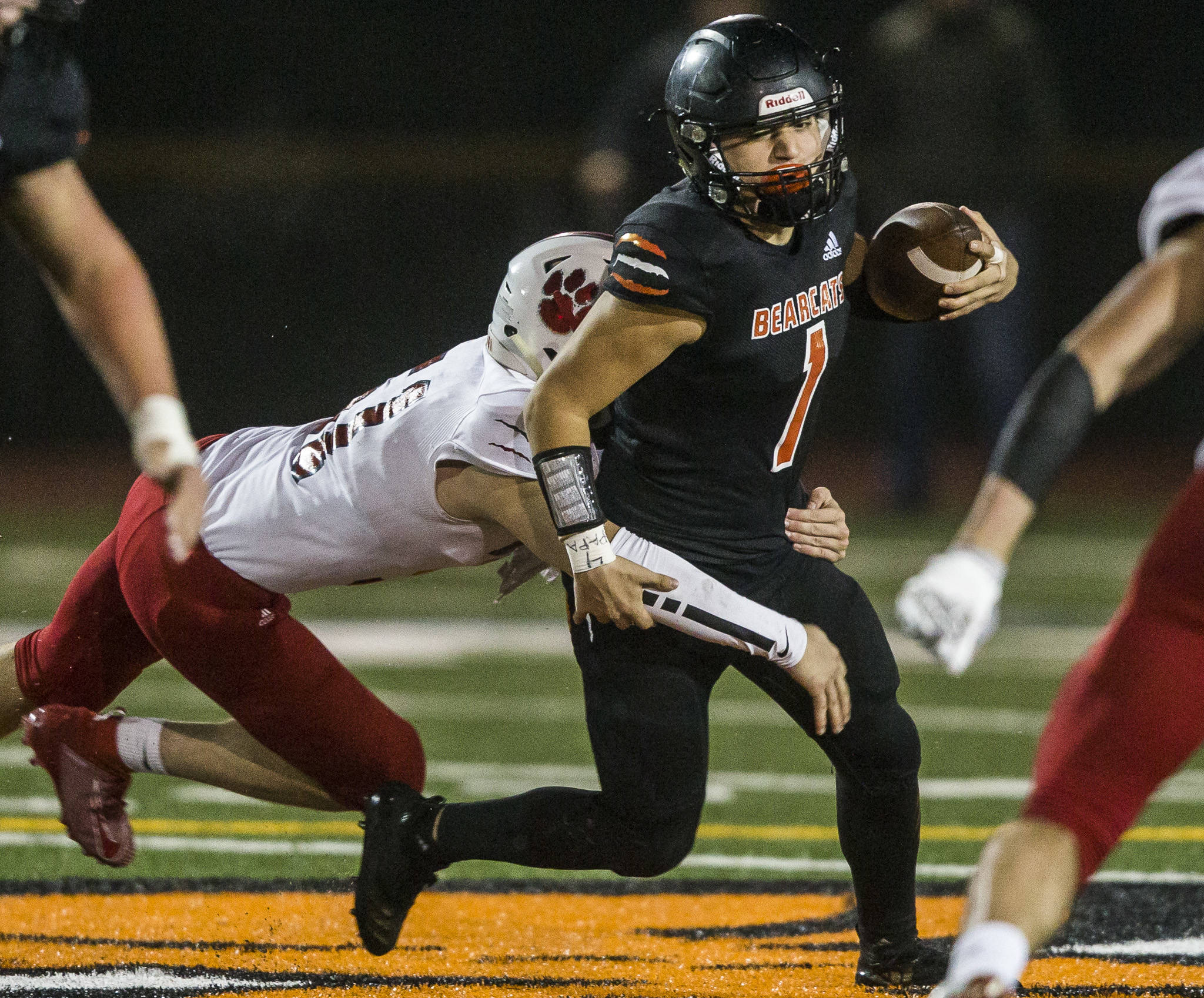 Monroe quarterback Gio Fregoso is sacked during a Week 10 playoff game against Mount Si on Saturday in Monroe. (Olivia Vanni / The Herald)