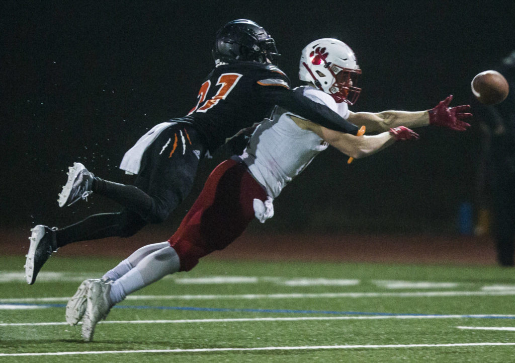 Monroe’s Trey Lane blocks a pass to Mount Si’s Andrew Mostofi during the 4A playoff game against Mount Si on Nov. 9, 2019 in Monroe, Wash. (Olivia Vanni / The Herald)
