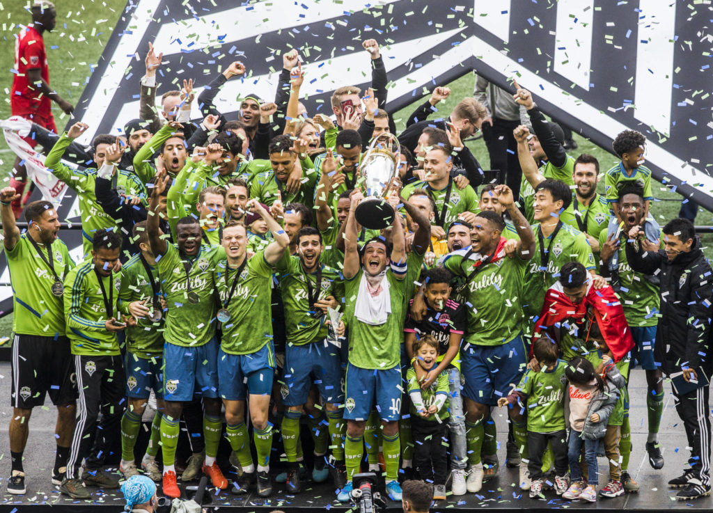 The Seattle Sounders lift the MLS Cup into the air after beating Toronto F.C. 3-1 to win the MLS Cup on Nov. 10, 2019 in Seattle, Wash. (Olivia Vanni / The Herald)
