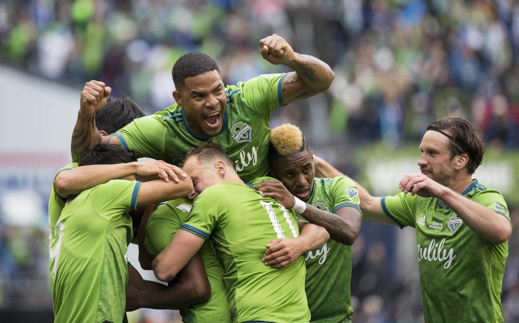 Sounders players celebrate the first goal by Sounders defender Kelvin Leerdam as the Seattle Sounders beat Toronto FC 3-1 to win the MLS Cup at CenturyLink Field on Sunday, Nov. 10, 2019 in Seattle, Wash. (Andy Bronson / The Herald)
