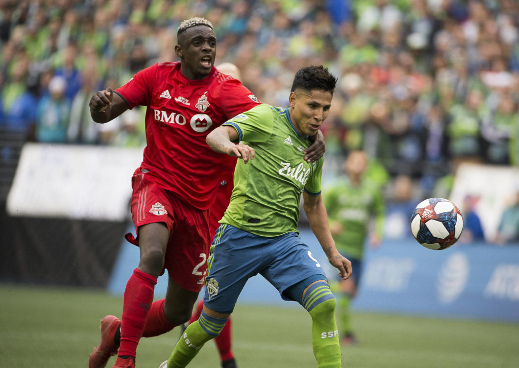 Toronto defender Chris Mavinga tries to stop Sounders forward Raúl Ruidíaz from scoring a goal. Ruidiaz scored and the Seattle Sounders beat Toronto FC 3-1 to win the MLS Cup at CenturyLink Field on Sunday, Nov. 10, 2019 in Seattle, Wash. (Andy Bronson / The Herald)
