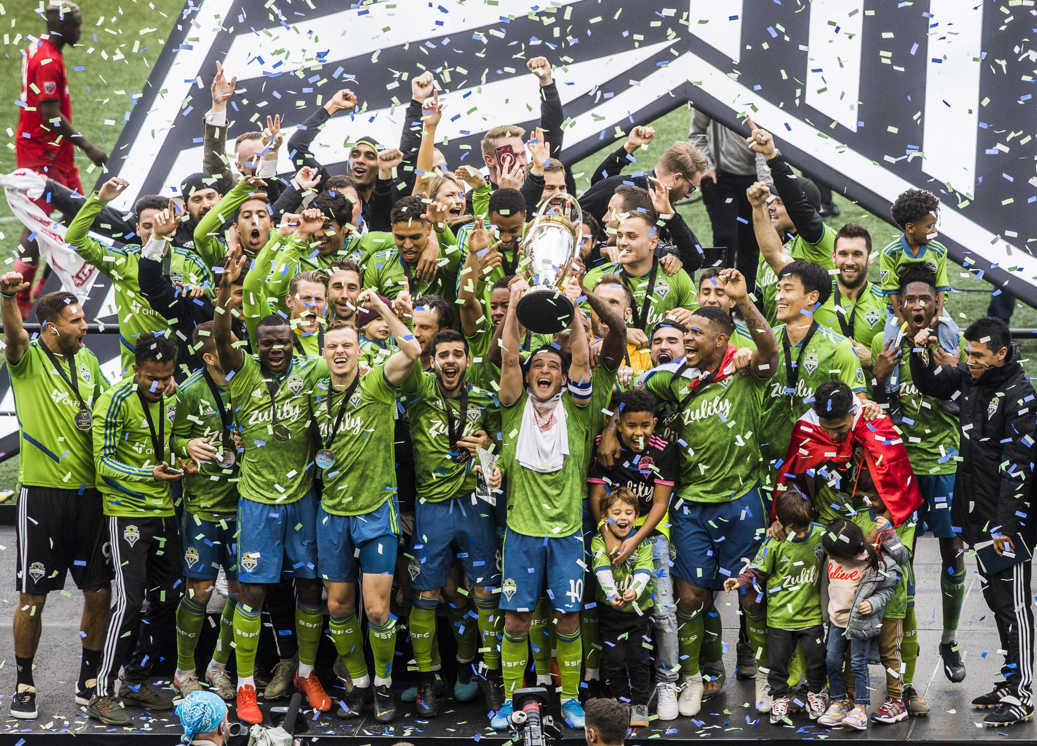 The Seattle Sounders lift the MLS Cup into the air after beating Toronto F.C. 3-1 to win the MLS Cup on Nov. 10, 2019 in Seattle, Wash. (Olivia Vanni / The Herald)