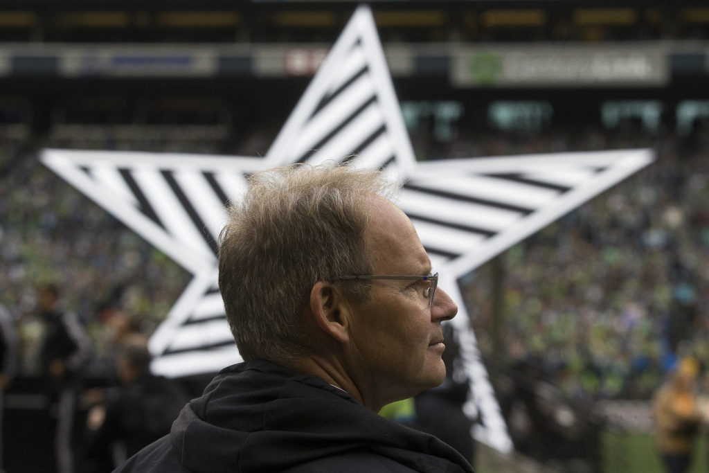 Seattle Sounders head coach Brian Schmetzer waits for the MLS CUP trophy to be presented after the Seattle Sounders beat Toronto FC 3-1 to win the MLS Cup at CenturyLink Field on Sunday, Nov. 10, 2019 in Seattle, Wash. (Andy Bronson / The Herald)
