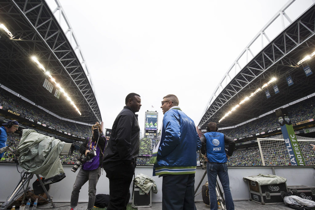 Ken Griffey Jr. and Macklemore talk before the Seattle Sounders beat Toronto FC 3-1 to win the MLS Cup at CenturyLink Field on Sunday, Nov. 10, 2019 in Seattle, Wash. (Andy Bronson / The Herald)
