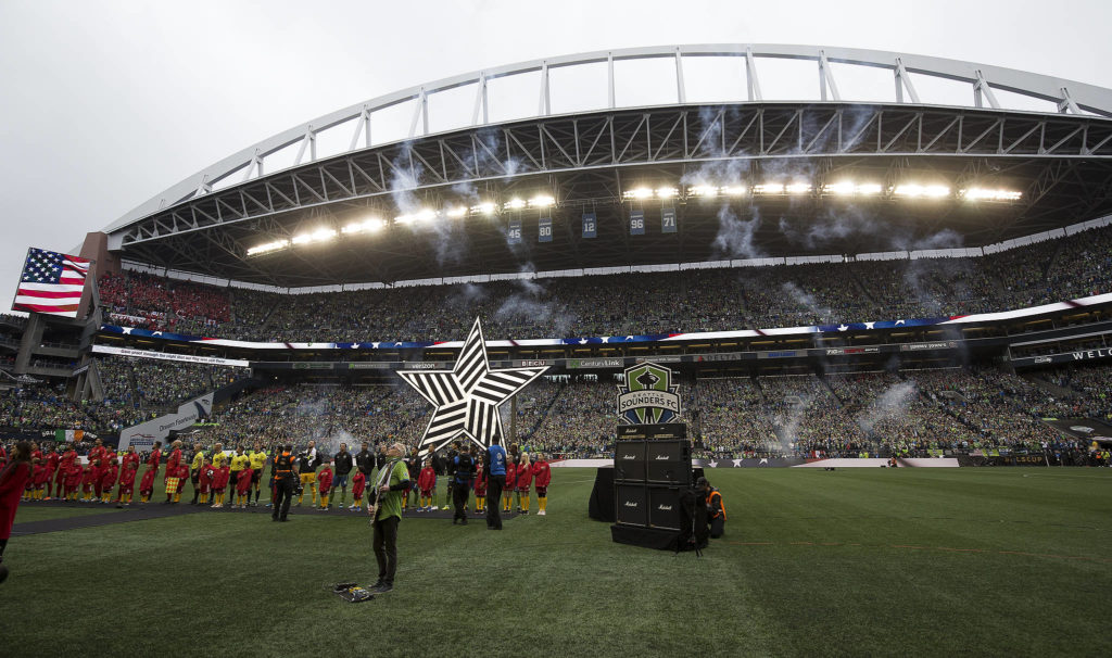 Pearl Jam guitarist Mike McCready plays the National Anthem before the Seattle Sounders beat Toronto FC 3-1 to win the MLS Cup at CenturyLink Field on Sunday, Nov. 10, 2019 in Seattle, Wash. (Andy Bronson / The Herald)
