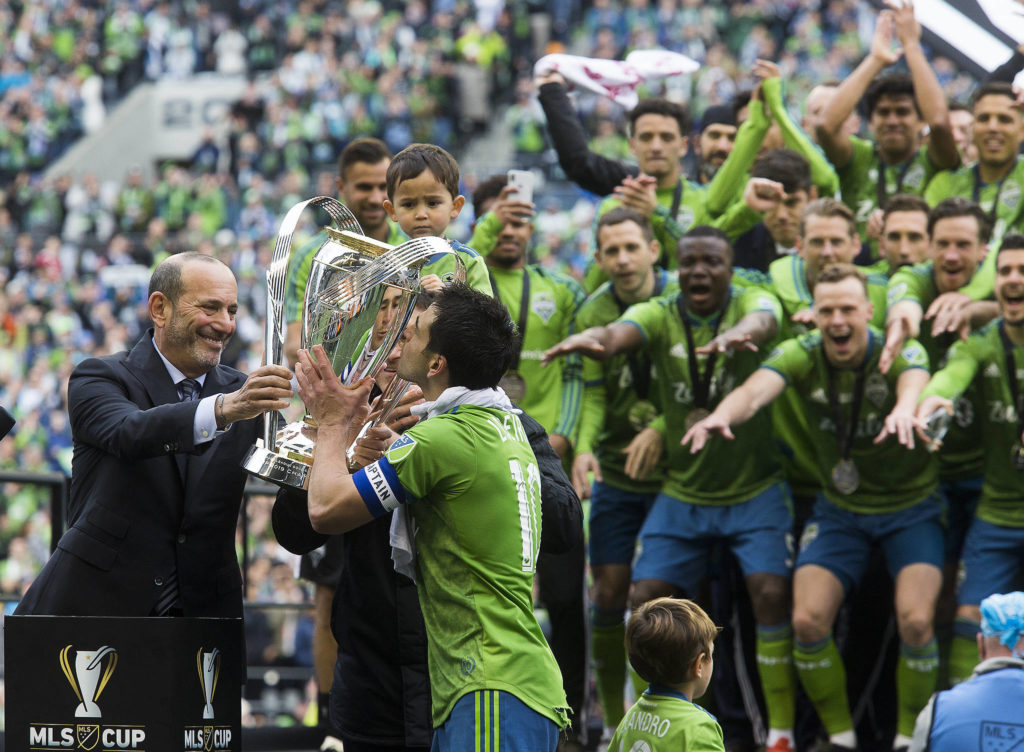 Sounders midfielder Nicolás Lodeiro kisses the MLS Cup trophy after the Seattle Sounders beat Toronto FC 3-1 to win the MLS Cup at CenturyLink Field on Sunday, Nov. 10, 2019 in Seattle, Wash. (Andy Bronson / The Herald)

