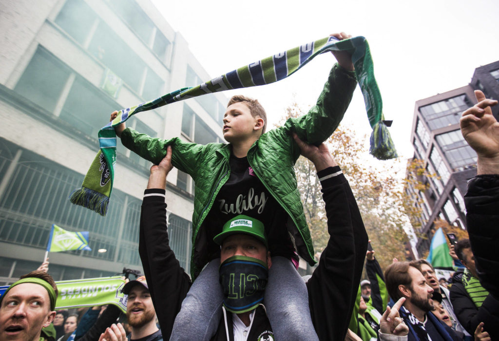 Sounders fans march down Occidental Ave before the MLS Cup on Nov. 10, 2019 in Seattle, Wash. (Olivia Vanni / The Herald)
