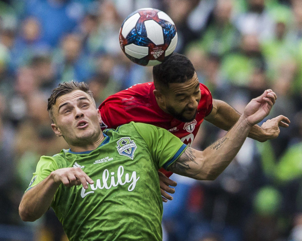 Sounders Jordan Morris jumps to head the ball during the MLS Cup on Nov. 10, 2019 in Seattle, Wash. (Olivia Vanni / The Herald)
